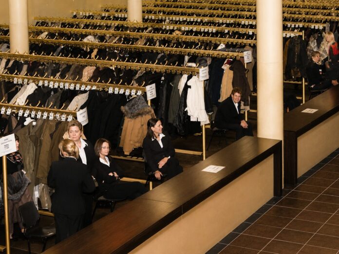 Elegant coat check, checkroom, with coats and tags
